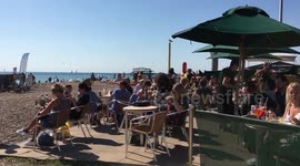 Summer’s back! Hordes gather on Brighton beach