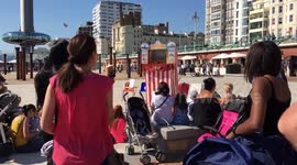 Summer’s back! Hordes gather on Brighton beach