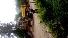 A hydromachine glided off a trailer giving the driver some minor injuries and the people of mount abu freaked out at this drastic situation