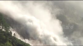 Spectacular shower of boulders bursts down mountainside