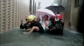 Firefighters rescue senior citizens from flooded house in southern China