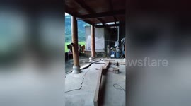 Villager captures home crumbling from the inside amid heavy flooding