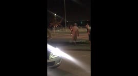 Drunk man struggling to walk falls down