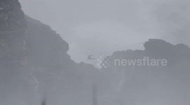 Daredevil slacklines over monster waves in Nazare, Portugal