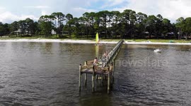 teenage boys do flip off ocean dock