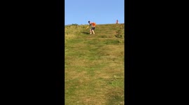 Loosing Footing Down a Steep Hill then a sliding fall at the end.