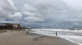 Dauphin Island, Alabama as Tropical Storm Gordon approaches - Gulf of Mexico waves crashing on beach