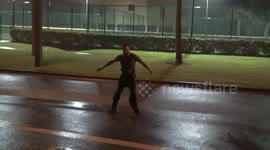 Crazy man stands in the middle of street, braves Storm Gordon