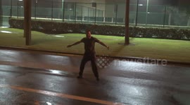 Crazy man stands in the middle of street, braves Storm Gordon