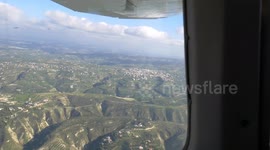 Inside a small plane looking at the amazing view outside - BRoll Pan, 60fps
