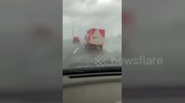 Truck tips over on Osaka highway during Typhoon Jebi