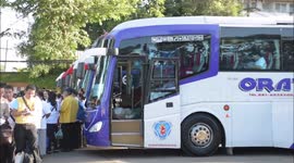 Thai cave rescue volunteers board buses to attend mass ceremony
