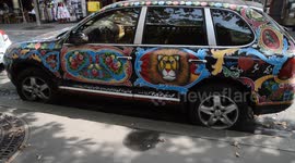 Pakistan truck art on a Porsche Cayenne in the streets of Paris,France, cathédrale Notre-Dame.