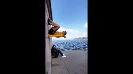Russian rolls up wall next to girl in St. Petersburg
