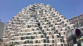 Bizarre Egyptian-inspired, pyramid-shaped high-rise building built in JIangsu Province