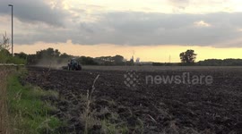 Farmer ploughing his field on a tractor