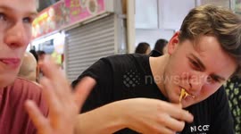 Brit tourists wretch when trying durian taste test in Singapore
