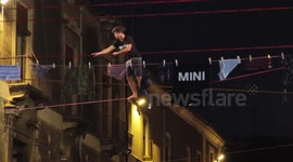 Impressive slacklining between balconies in Catania, Italy
