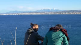 Girl and guy talk and watch stunning view