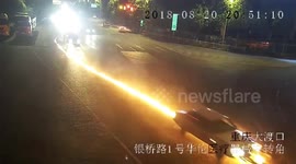 Hit-and-run car drags motorcycle along road in flames