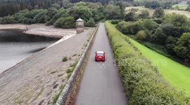 Fernilee Reservoir - Flying backwards as a car drives below