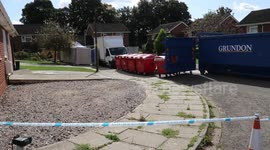 Scores of skips line up to be taken away after decontamination work at Skripal home