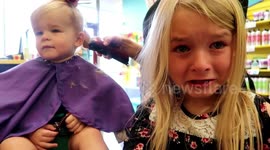 Bella cries at baby brother's first haircut