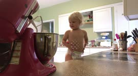 Adorable moment 2-year-old tries baking cookies for the first time