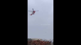 Rescue helicopter landing in snow