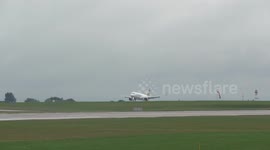 Thomas Cook Aircraft lands after flood causes Manchester Airport runway to shut