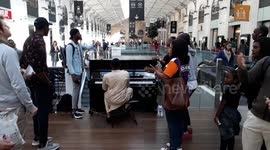 Gospel singers lift spirits at Paris train station