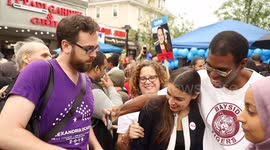 Alexandria Ocasio-Cortez poses for pictures at Queens rally