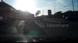 Ford Explorer drives over curb