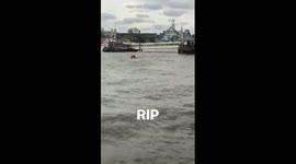 Guys on a small boat on the Thames
