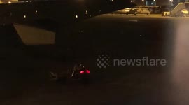 Airport ground crew put on light show for passengers