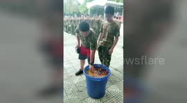 High school freshers forced to eat swill during military training