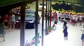 Teacher in BMW ploughs into pupils by mistake at the school gates