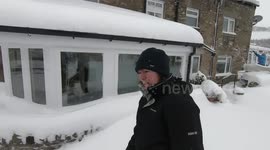 Beast from the east hits Allendale. Removing snow from the car.