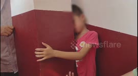 Boy somehow manages to get his head stuck in impossibly tiny gap