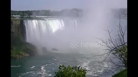 Horseshoe Falls,  in Niagara Falls-Daytime, mist and bird flying