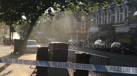 Smoke spills from car roof in south London