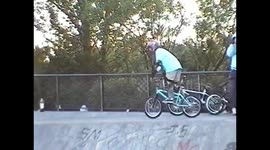 BMX rider goes over the bars