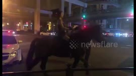 Chinese woman rides horse on streets
