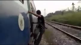 Thief risks own life to steal from moving train in India