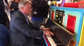 Ed Balls plays piano at Leeds station