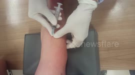 Giving a blood sample.