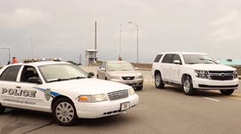 N. Carolina Coast: Car evacuates off draw bridge from Wrightsville Beach just before storm