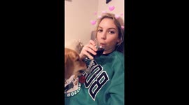 Puppy tries to steal owner's wine