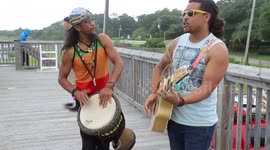 Acoustic duo plays outside as Hurricane Florence’s rain starts to fall