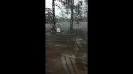 Residents drive through flooded roads as Hurricane Florence nears Carolina coast